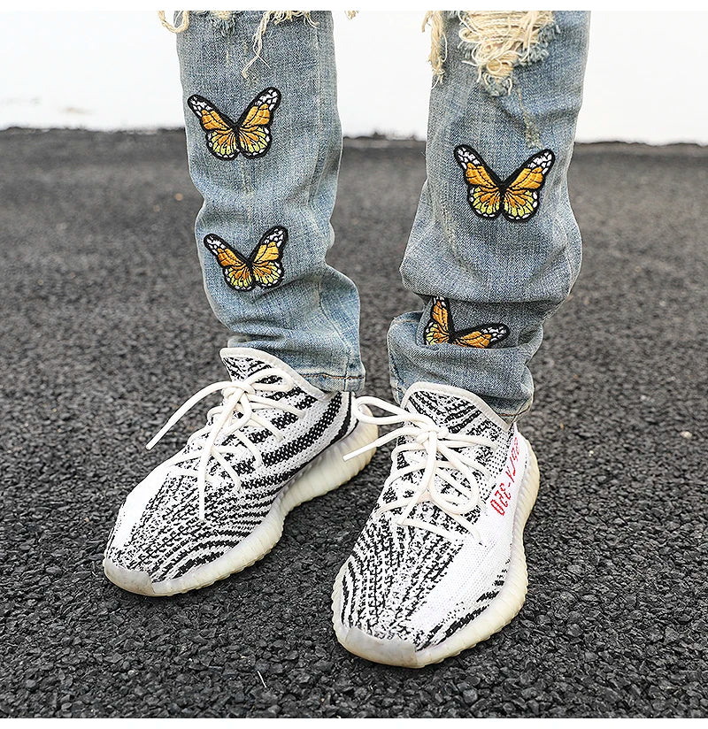 high street butterfly embroidery knee ripped hole jeans mens casual hip hop distressed jeans slim fit skinny denim pants joggers unique joggers style 883