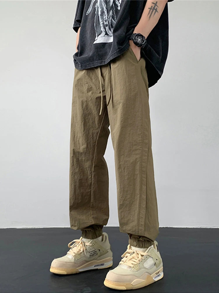 summer mens solid color breathable trousers male casual elastic waist fitness joggers sweatpants autumn baggy straight pants unique joggers style 3535