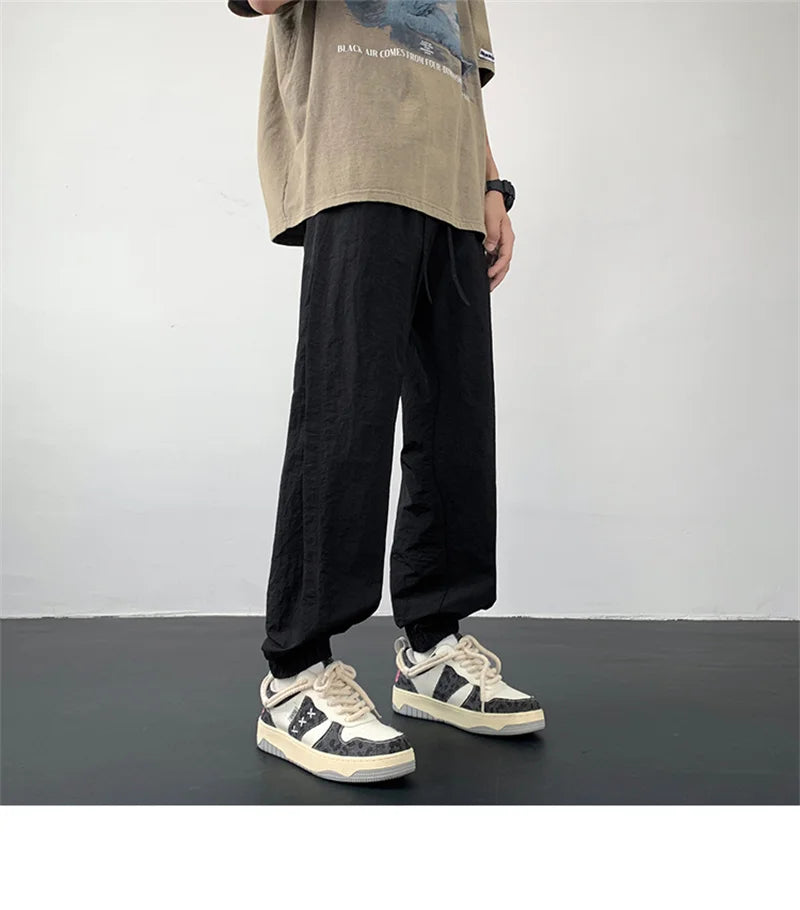 summer mens solid color breathable trousers male casual elastic waist fitness joggers sweatpants autumn baggy straight pants unique joggers style 3525