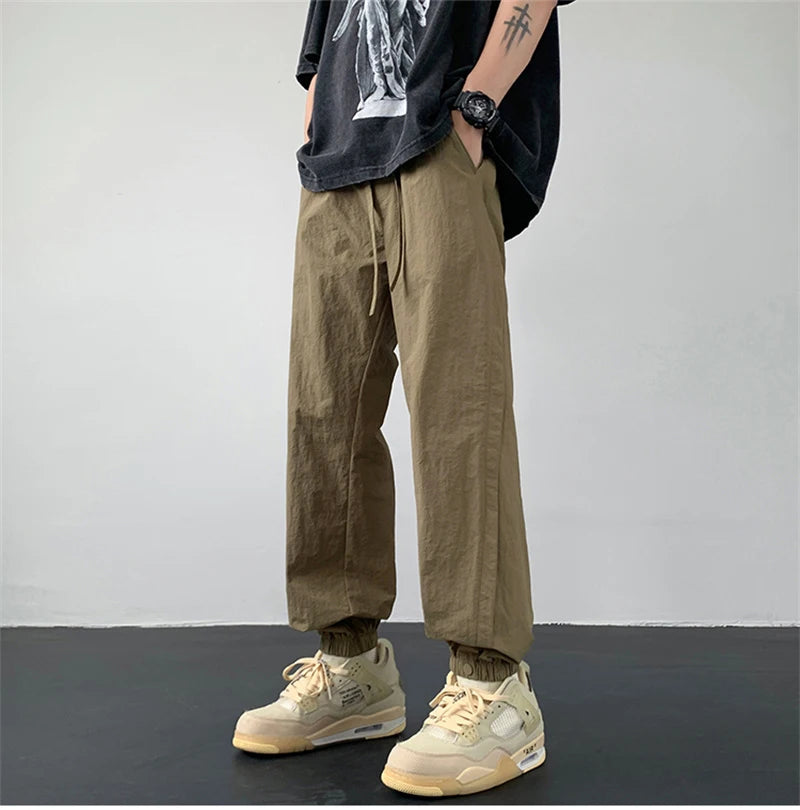 summer mens solid color breathable trousers male casual elastic waist fitness joggers sweatpants autumn baggy straight pants unique joggers style 3521