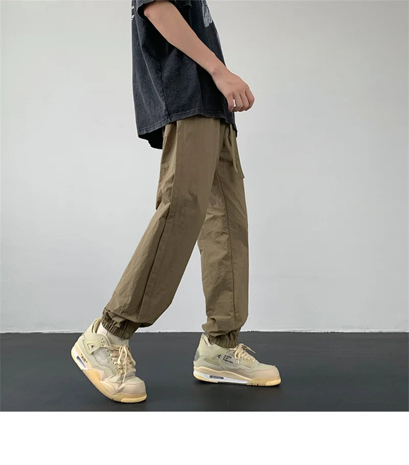 summer mens solid color breathable trousers male casual elastic waist fitness joggers sweatpants autumn baggy straight pants unique joggers style 3516