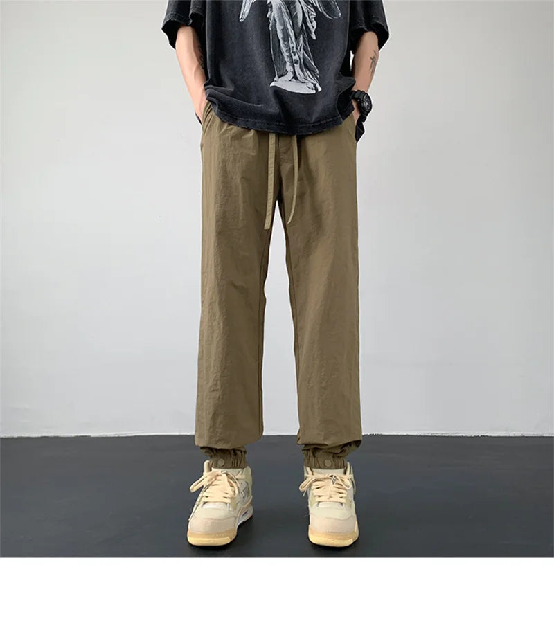 summer mens solid color breathable trousers male casual elastic waist fitness joggers sweatpants autumn baggy straight pants unique joggers style 3519