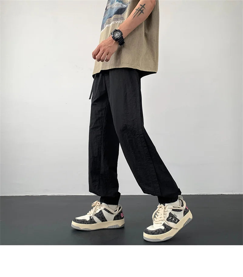 summer mens solid color breathable trousers male casual elastic waist fitness joggers sweatpants autumn baggy straight pants unique joggers style 3530