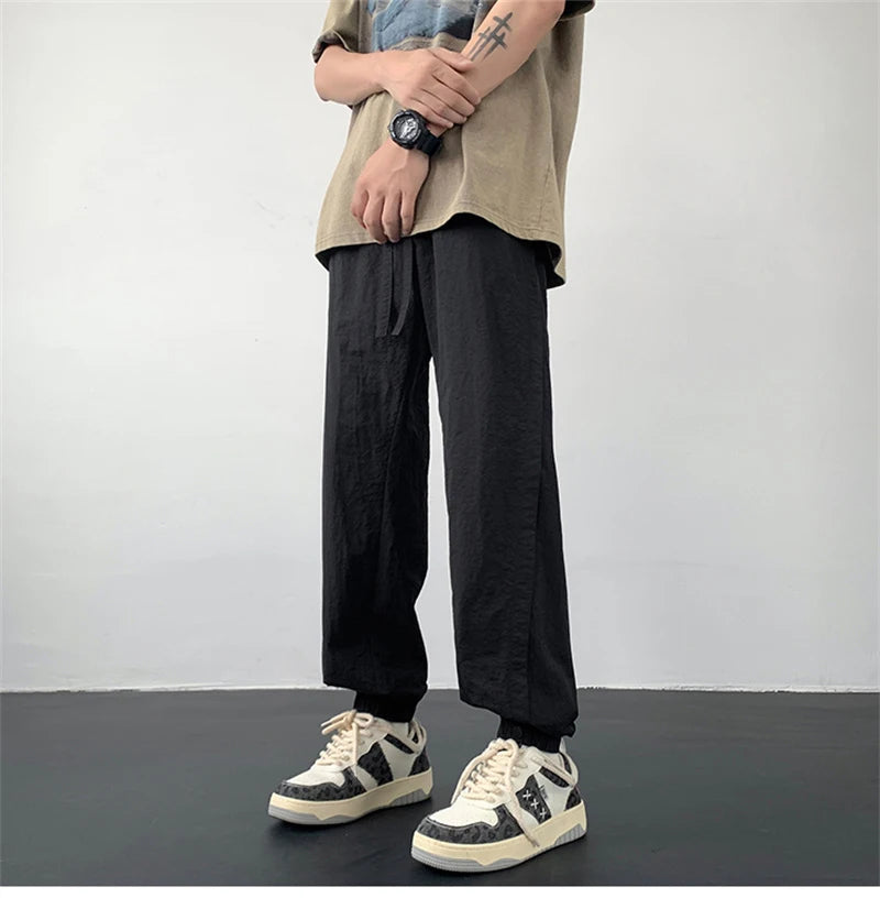 summer mens solid color breathable trousers male casual elastic waist fitness joggers sweatpants autumn baggy straight pants unique joggers style 3529