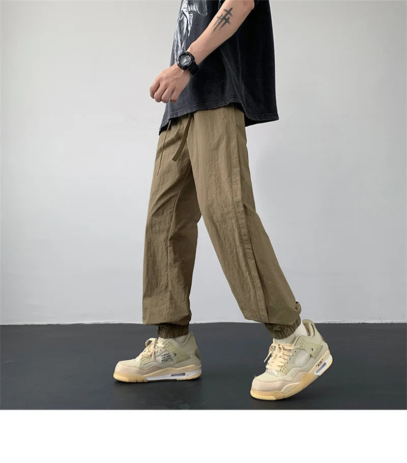 summer mens solid color breathable trousers male casual elastic waist fitness joggers sweatpants autumn baggy straight pants unique joggers style 3518