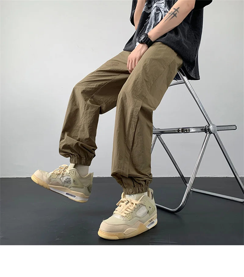summer mens solid color breathable trousers male casual elastic waist fitness joggers sweatpants autumn baggy straight pants unique joggers style 3524