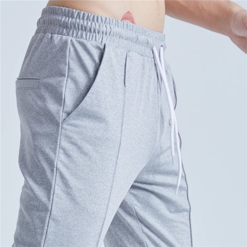 rainbowtouches new thin casual pants men fashion slim fit solid color brand trousers sweatpants elastic men workout pant unique joggers style 5074
