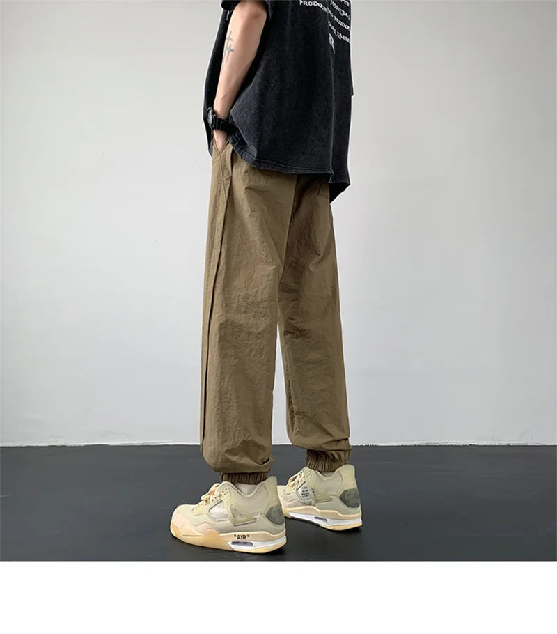 summer mens solid color breathable trousers male casual elastic waist fitness joggers sweatpants autumn baggy straight pants unique joggers style 3517